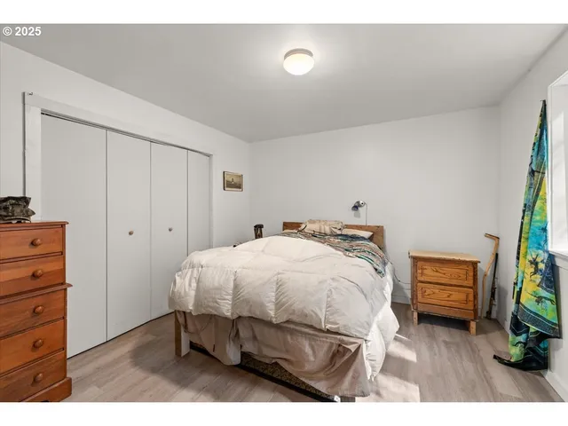 a bedroom with a bed and a dresser