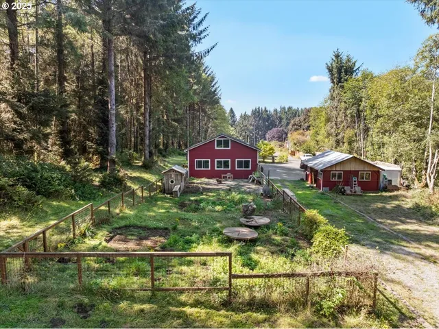 a view of a house with a yard from a balcony
