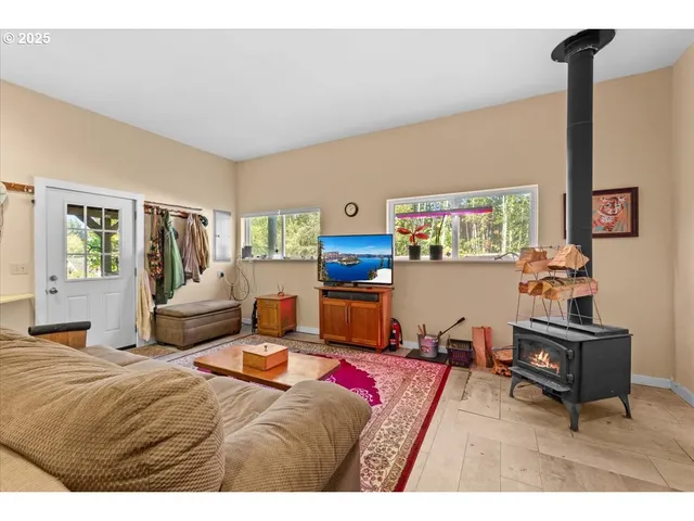 a bedroom with a bed window and couch