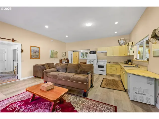 a living room with furniture and a table