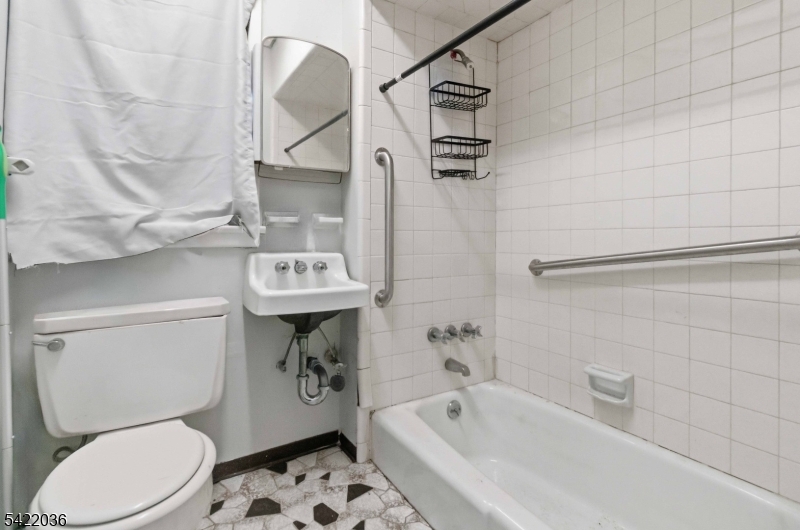 36 Edison Street Bloomfield, NJ 07003 - Photo 17 of 28 a bathroom with a sink toilet and shower