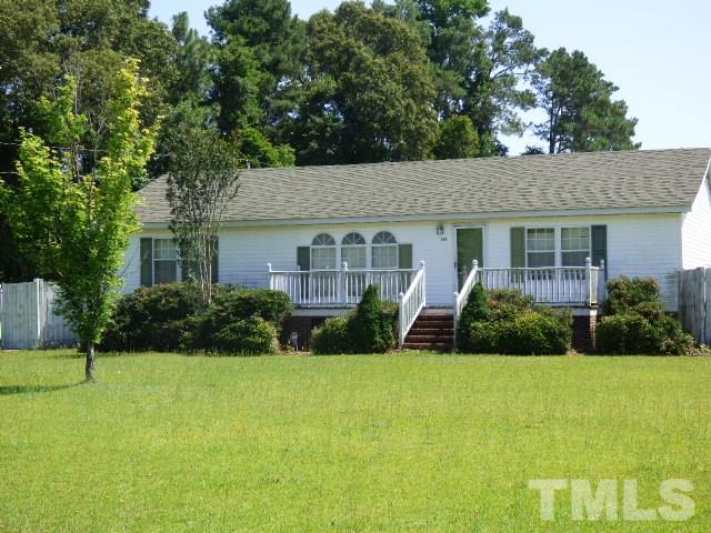 3855 Reedy Prong Church Road Dunn, NC 28334 - Photo 1 of 25 a front view of a house with a yard and green space