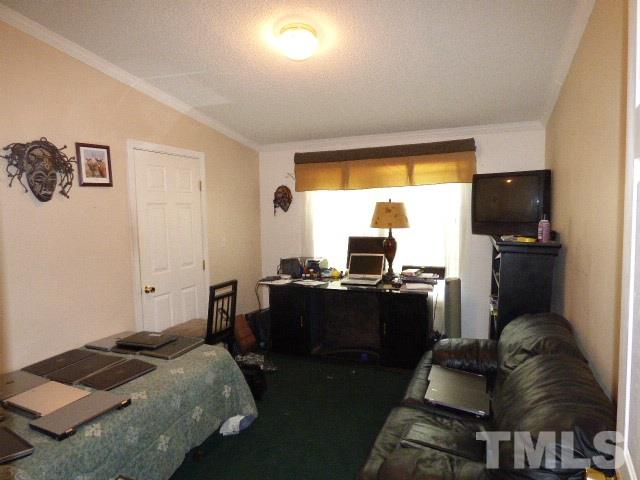 3855 Reedy Prong Church Road Dunn, NC 28334 - Photo 19 of 25 a bedroom with a bed and furniture