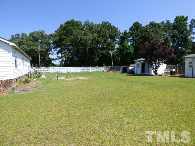 3855 Reedy Prong Church Road Dunn, NC 28334 - Photo 21 of 25 a view of a swimming pool with a yard