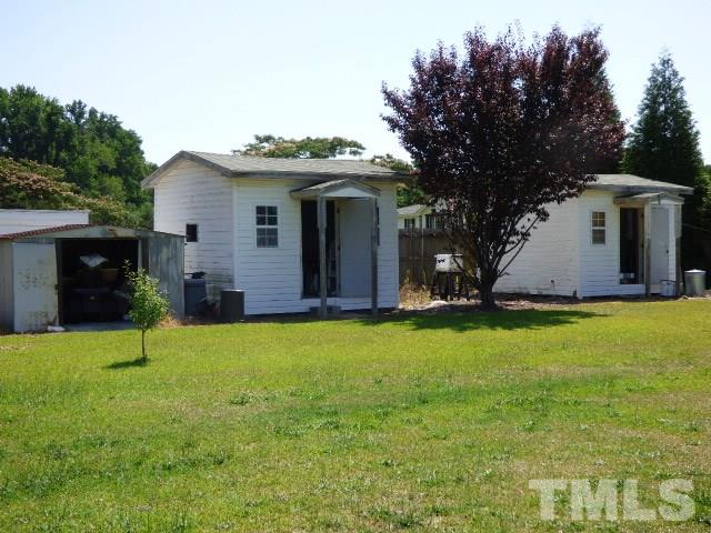 3855 Reedy Prong Church Road Dunn, NC 28334 - Photo 23 of 25 a view of a house with a yard