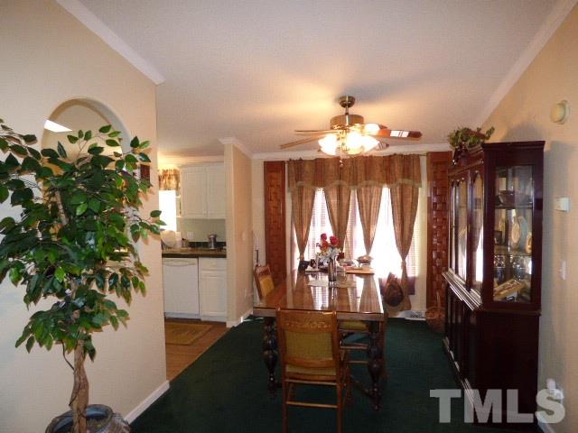 3855 Reedy Prong Church Road Dunn, NC 28334 - Photo 5 of 25 a view of a dining room with furniture and chandelier