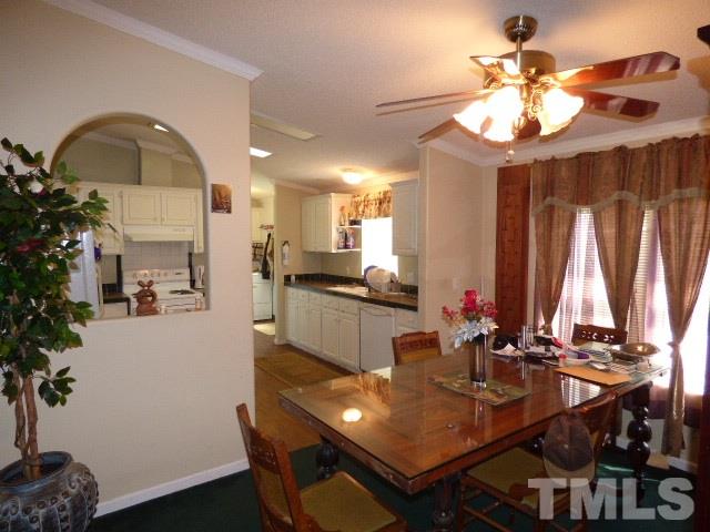 3855 Reedy Prong Church Road Dunn, NC 28334 - Photo 9 of 25 a view of a dining room with furniture and a chandelier