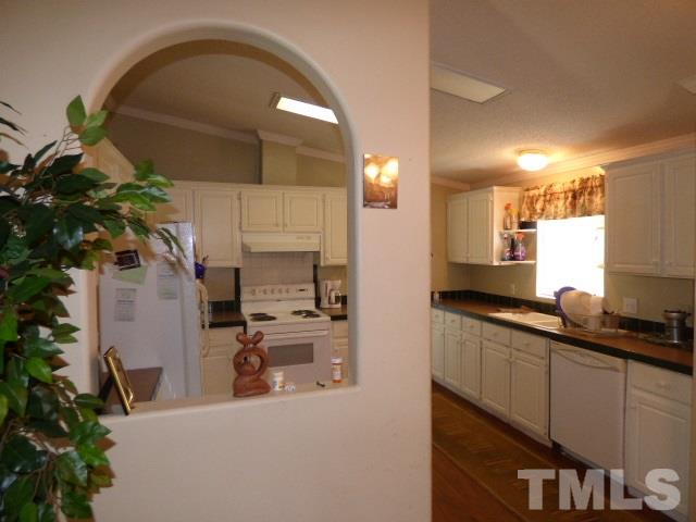 3855 Reedy Prong Church Road Dunn, NC 28334 - Photo 10 of 25 a kitchen with sink a faucet and cabinets