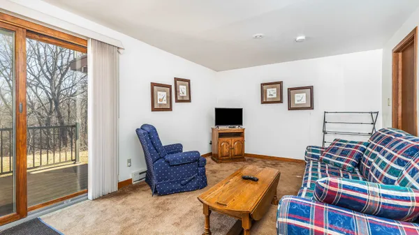 a bedroom with two beds and painting on the wall