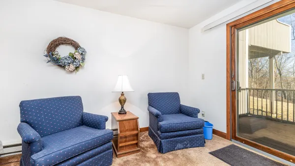 a bedroom with a bed and a lamp