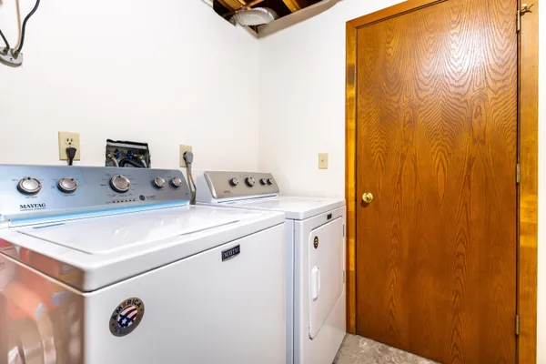 a view of backyard with wheel and chairs