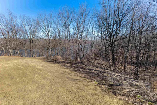 a view of yard covered with snow in front of house