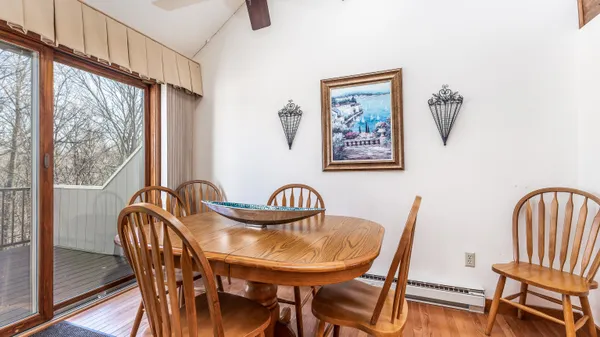 a view of a dining room with furniture window and outside view