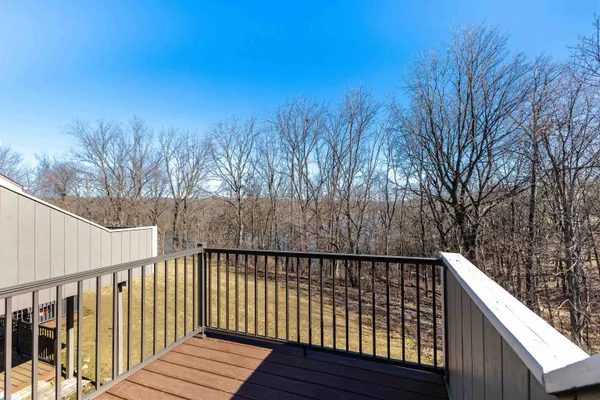 a balcony with trees in front of it