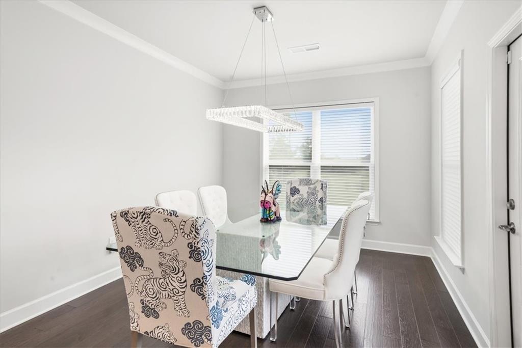 2457 Naples Street Hoschton, GA 30548 - Photo 15 of 41 a dining room with furniture and window
