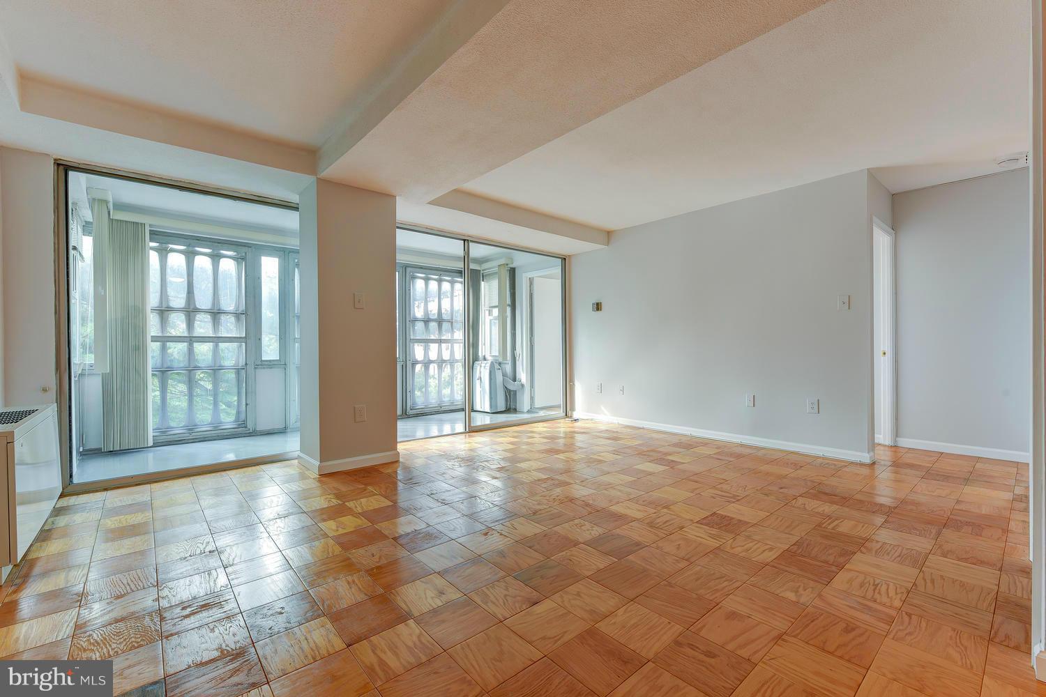1311 Delaware Avenue Southwest, Unit S131 Washington, DC 20024 - Photo 2 of 18 a view of an empty room with glass door