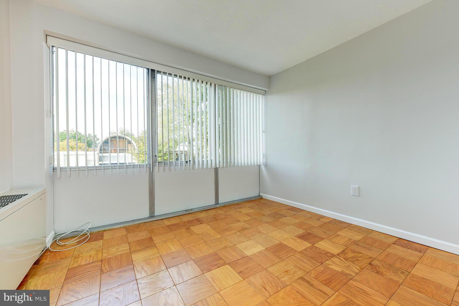 1311 Delaware Avenue Southwest, Unit S131 Washington, DC 20024 - Photo 13 of 18 a view of an empty room and window