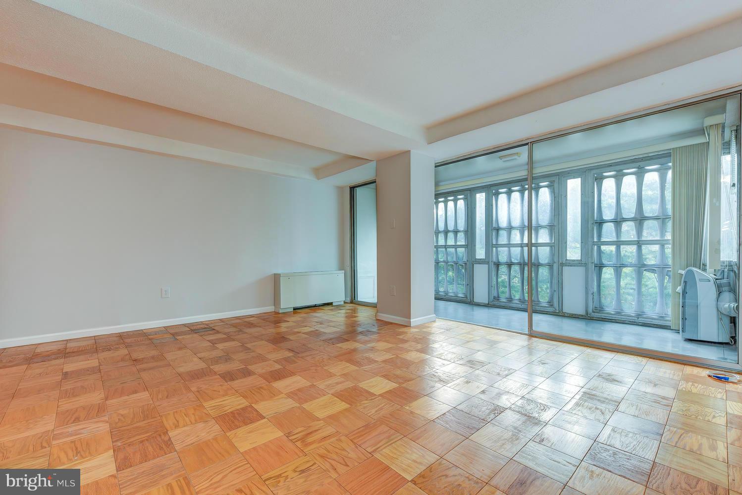 1311 Delaware Avenue Southwest, Unit S131 Washington, DC 20024 - Photo 3 of 18 a view of an empty room and window