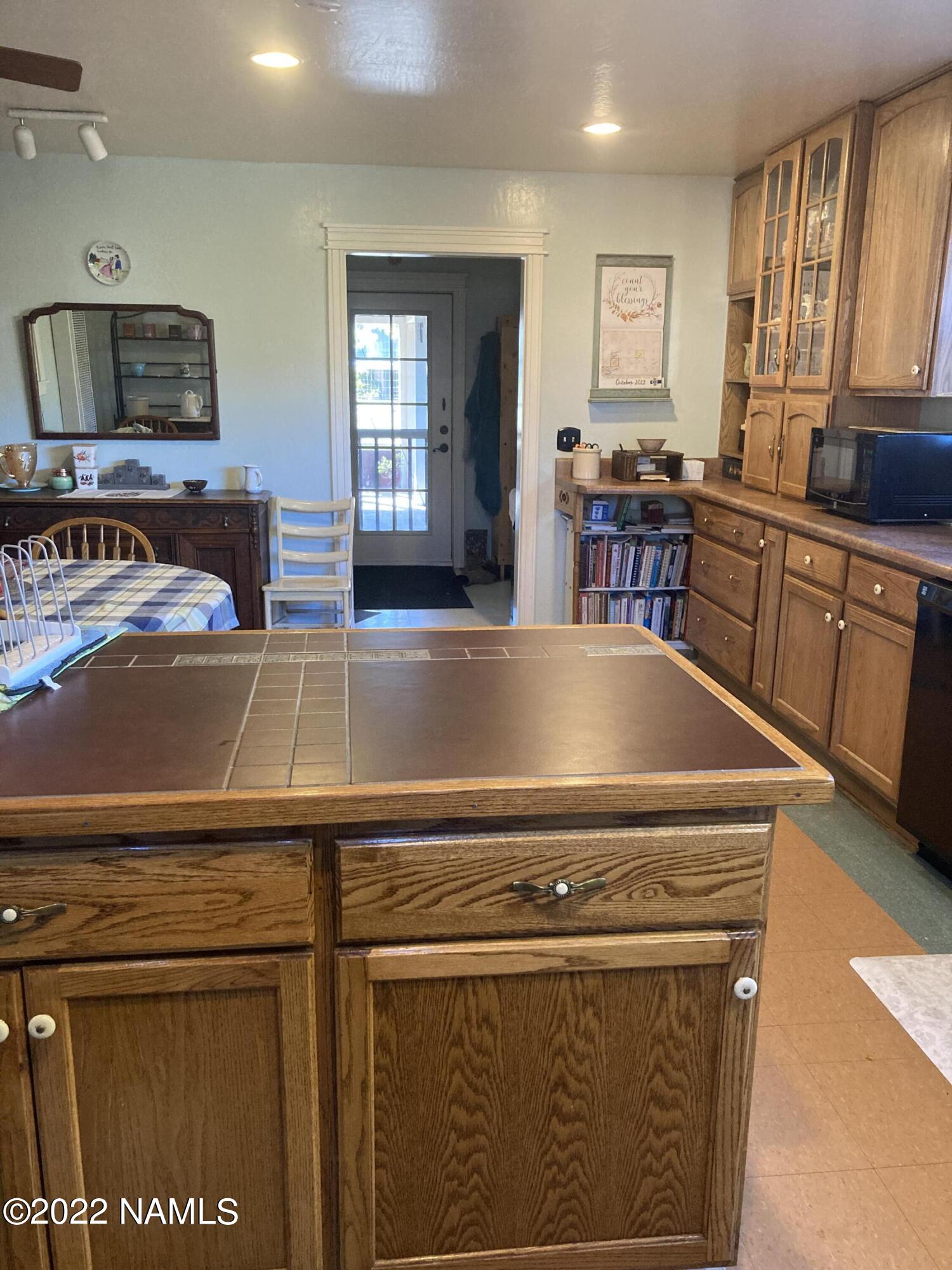 9682 Pioneer Valley Road Flagstaff, AZ 86004 - Photo 19 of 43 kitchen to patio