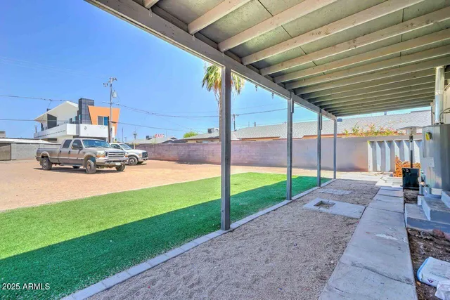 a view of a backyard with porch