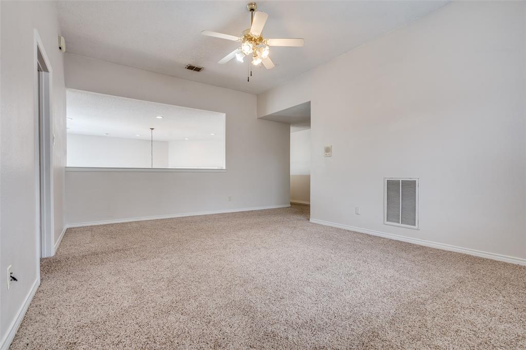 3421 Neiman Road Plano, TX 75025 - Photo 28 of 40 Carpeted spare room with a ceiling fan and baseboards