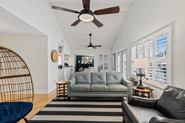 a bedroom with a bed and a flat tv screen on a dresser