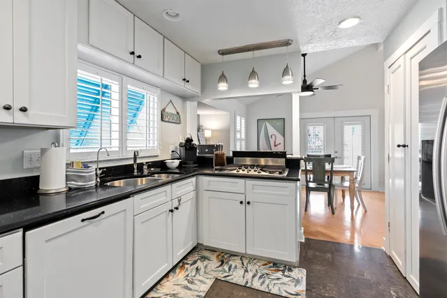 a bed sitting in a room next to a window