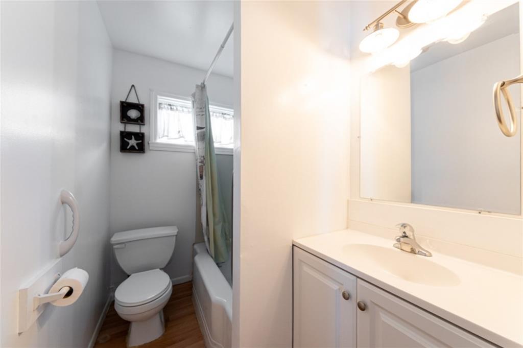 222 Reis Run Road Pittsburgh, PA 15237 - Photo 19 of 25 a bathroom with a granite countertop toilet sink and mirror