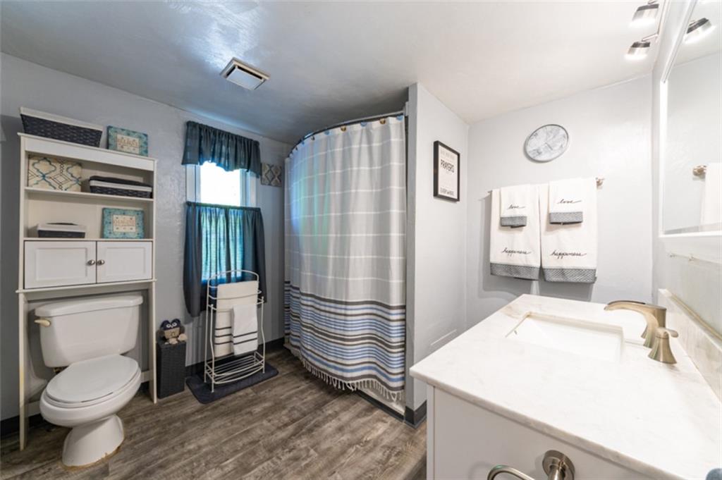 222 Reis Run Road Pittsburgh, PA 15237 - Photo 10 of 25 a bathroom with a sink a toilet and shower