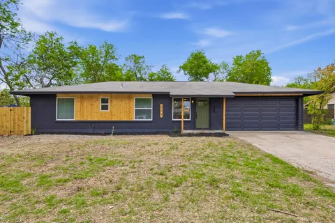 a house with trees in the background