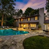 a view of a house with a yard and plants