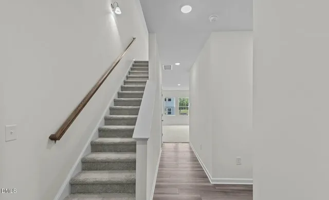 a view of entryway with wooden floor