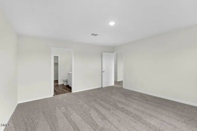 a view of a big room with wooden floor and natural light