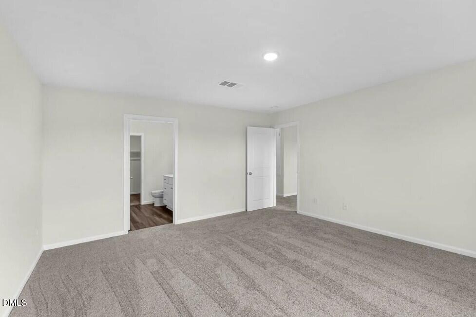 660 Essex Road Nashville, NC 27856 - Photo 14 of 22 a view of a big room with wooden floor and natural light