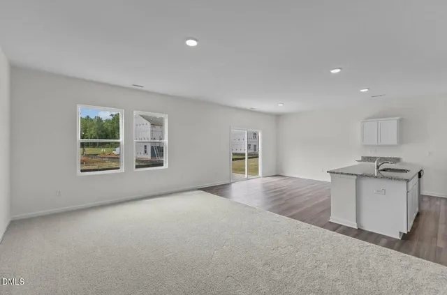 a view of a kitchen with a sink cabinets and a window