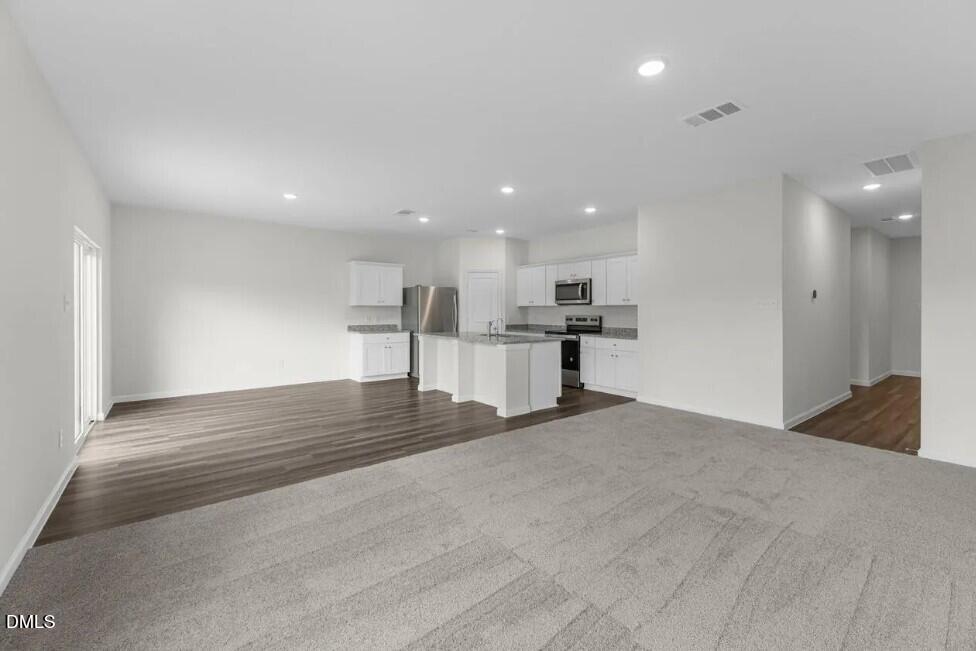 660 Essex Road Nashville, NC 27856 - Photo 9 of 22 a view of kitchen with refrigerator and window