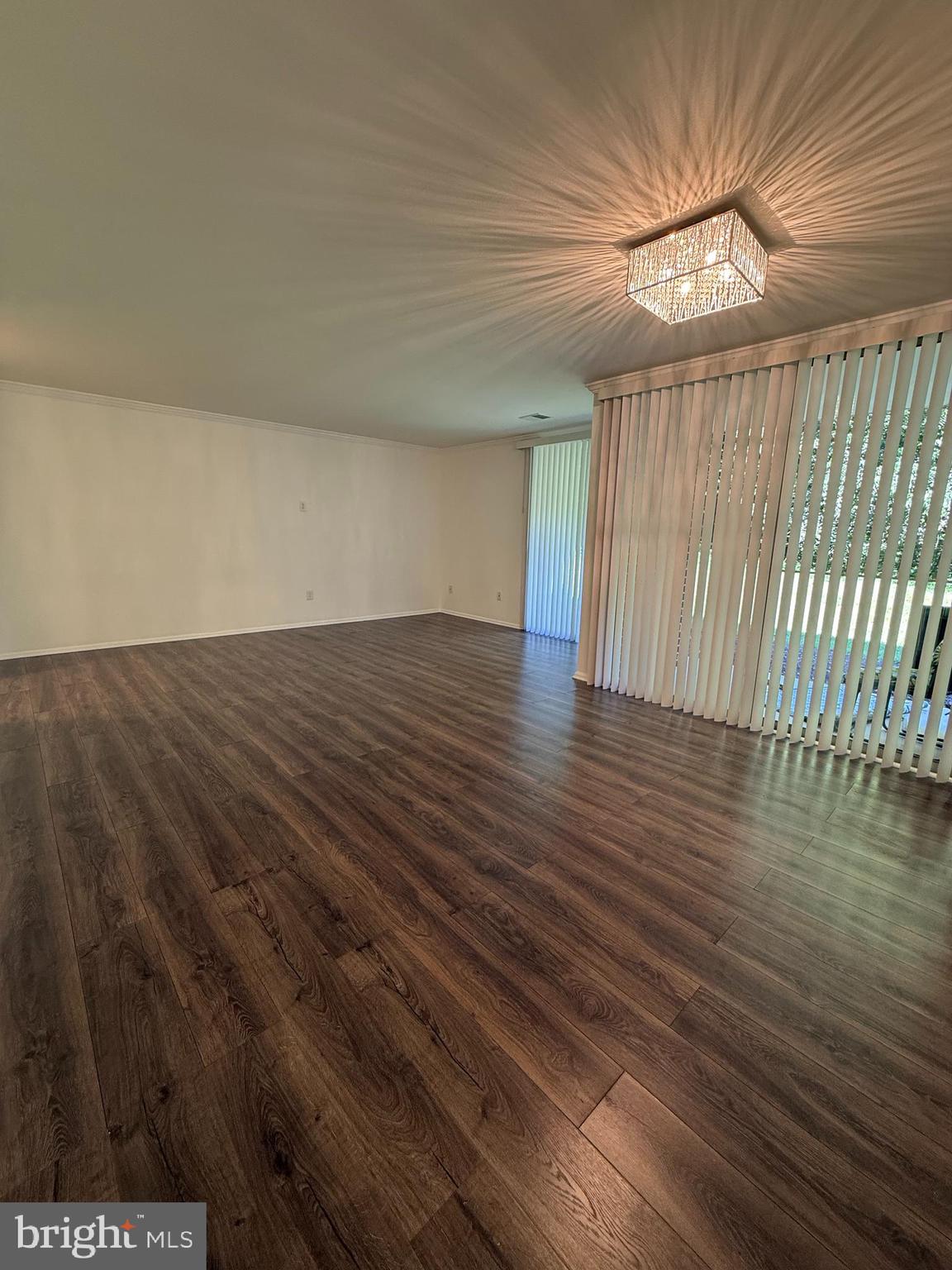 10244 Prince Place, Unit 21T3 Upper Marlboro, MD 20774 - Photo 25 of 64 wooden floor in an empty room with a window