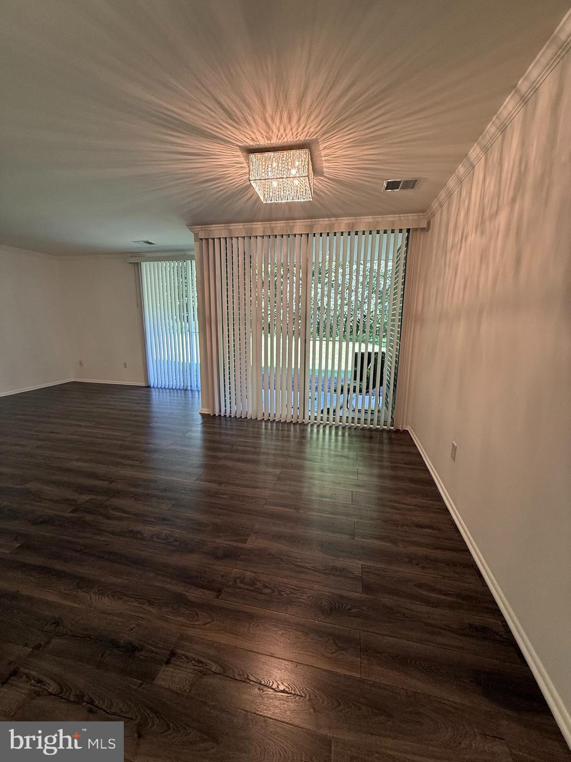 10244 Prince Place, Unit 21T3 Upper Marlboro, MD 20774 - Photo 27 of 64 wooden floor in an empty room with a window