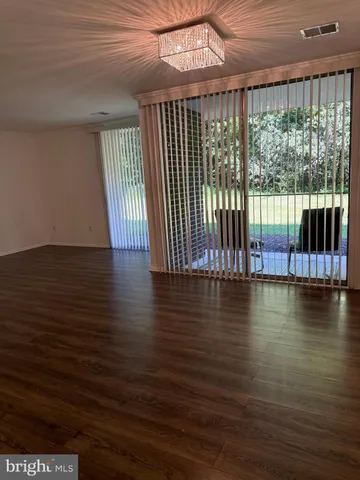 a bed room with a bed and a chair