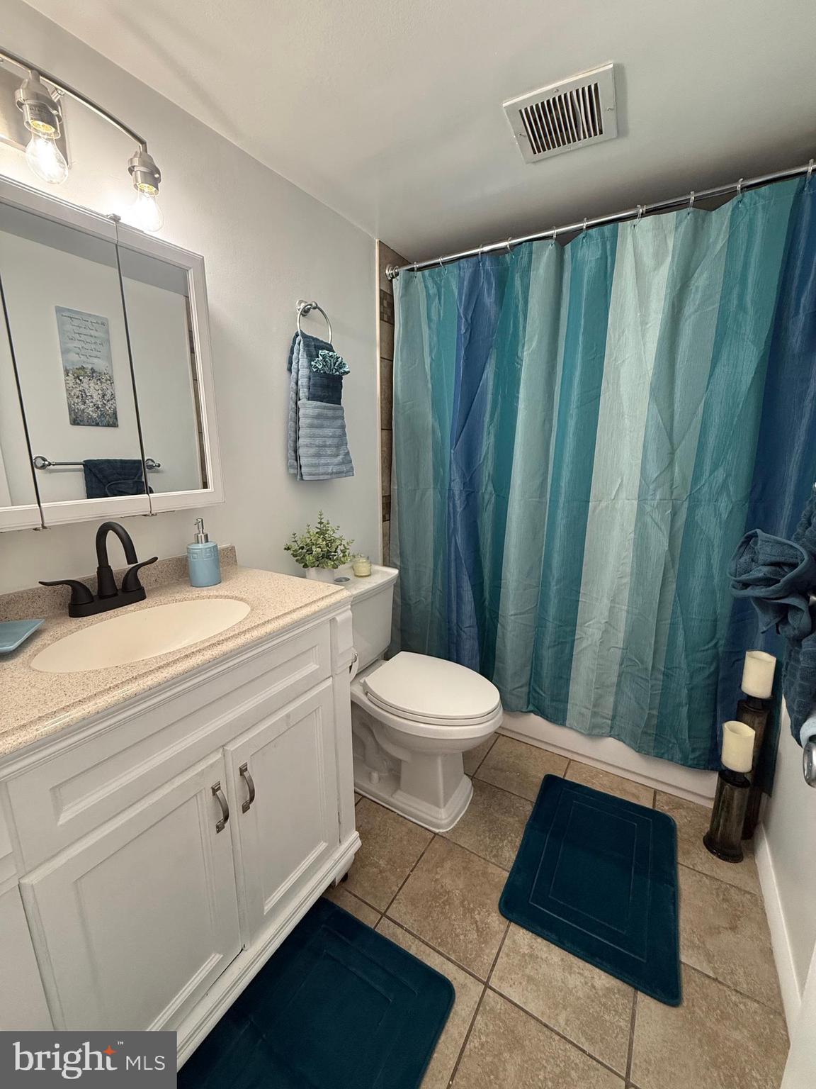 10244 Prince Place, Unit 21T3 Upper Marlboro, MD 20774 - Photo 32 of 64 a bathroom with a sink and a mirror
