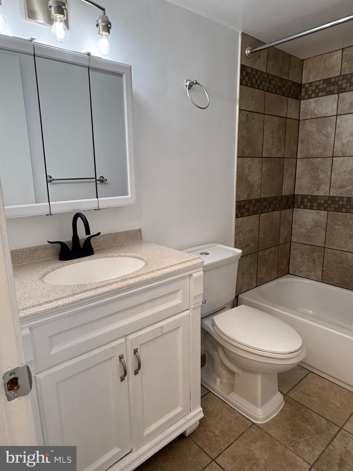 10244 Prince Place, Unit 21T3 Upper Marlboro, MD 20774 - Photo 33 of 64 a bathroom with a sink toilet and shower
