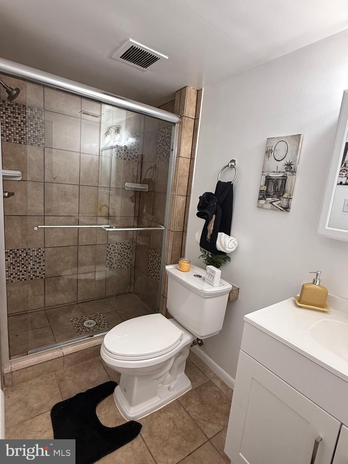 10244 Prince Place, Unit 21T3 Upper Marlboro, MD 20774 - Photo 45 of 64 a bathroom with a toilet and a shower