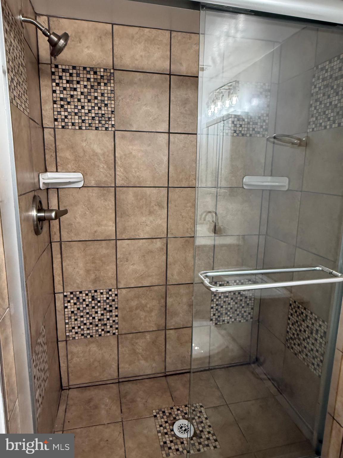 10244 Prince Place, Unit 21T3 Upper Marlboro, MD 20774 - Photo 46 of 64 a bathroom with a shower