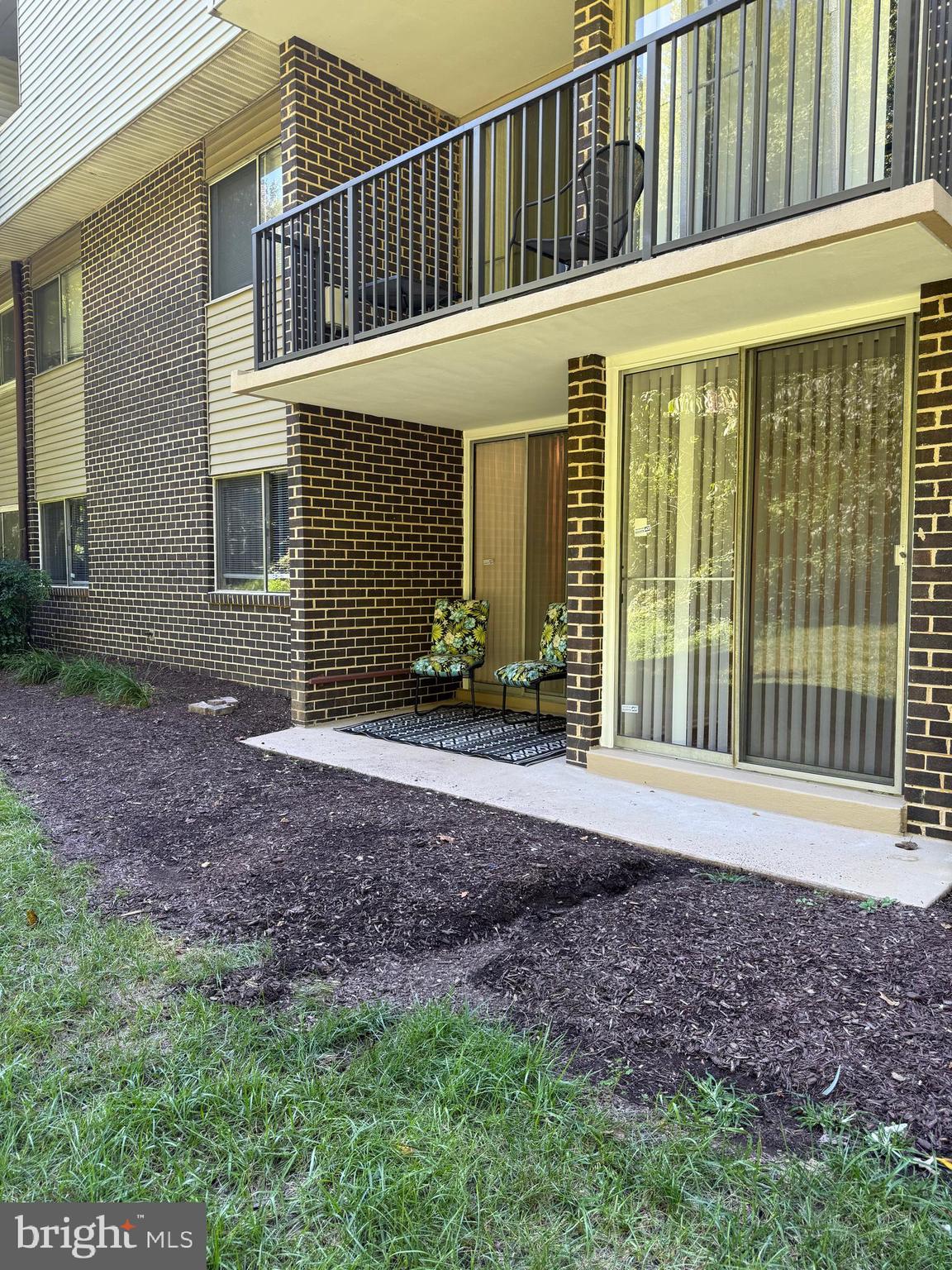 10244 Prince Place, Unit 21T3 Upper Marlboro, MD 20774 - Photo 51 of 64 a view of a house with backyard and porch
