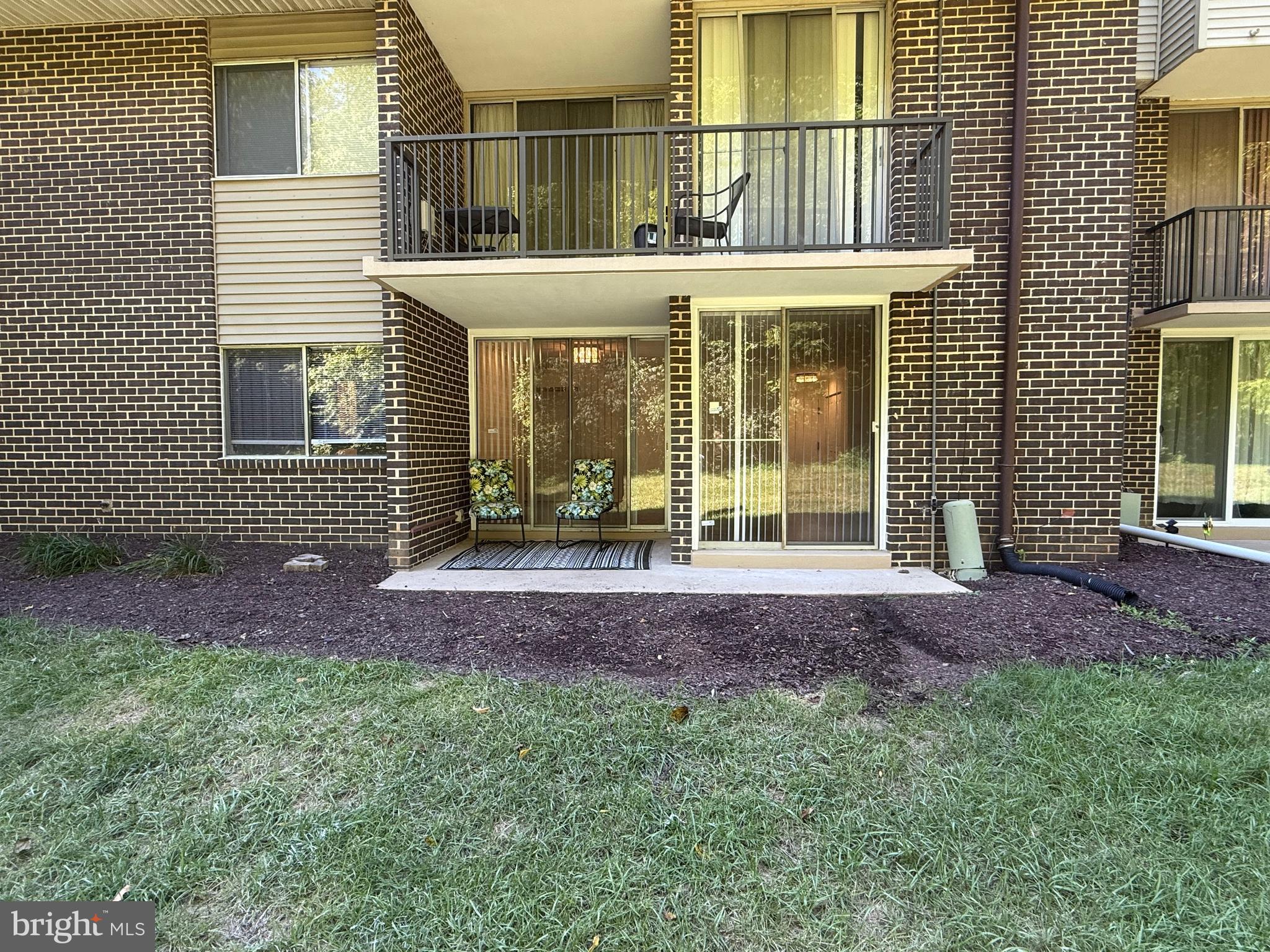 10244 Prince Place, Unit 21T3 Upper Marlboro, MD 20774 - Photo 52 of 64 a front view of a house with a yard
