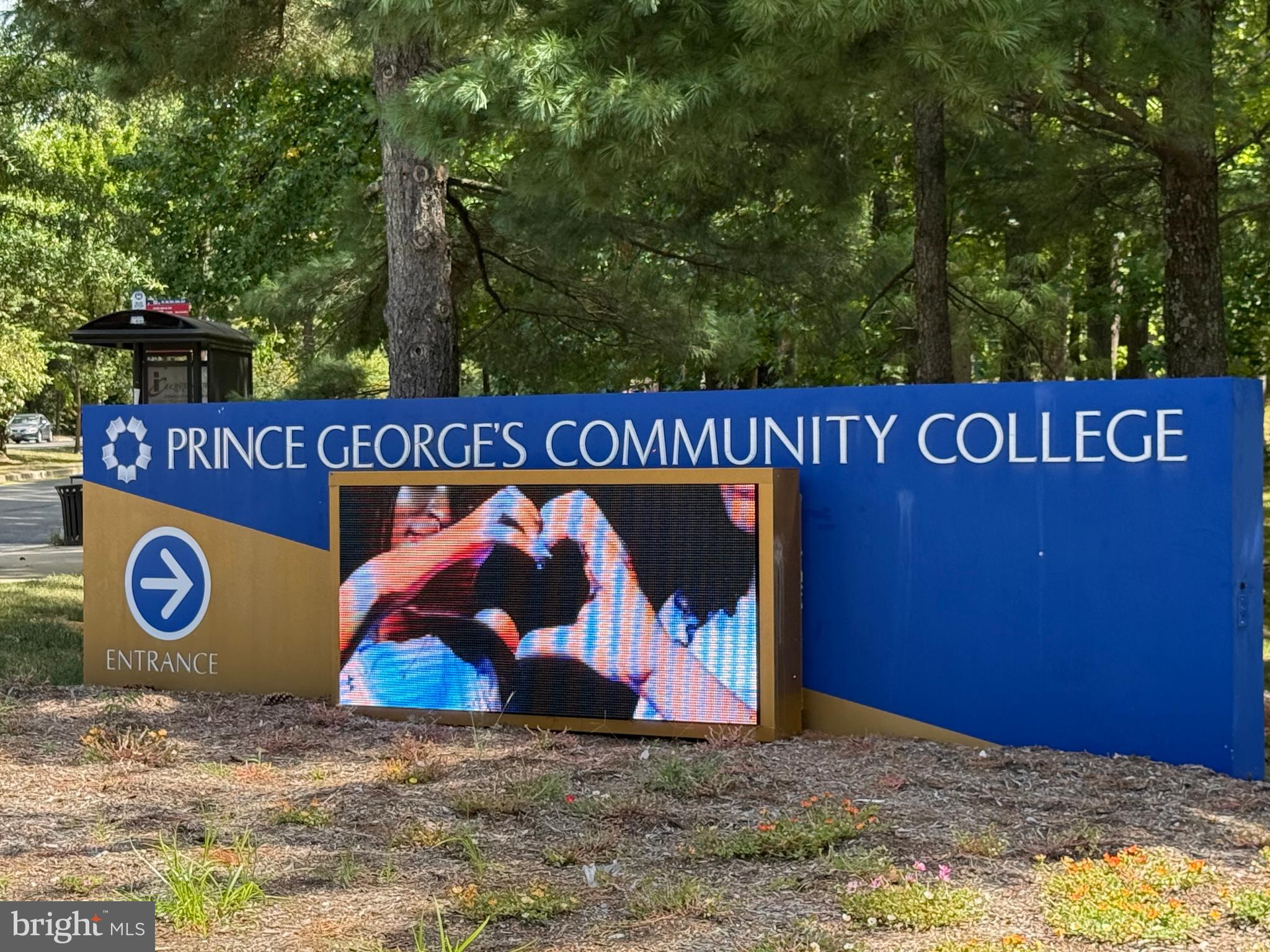 10244 Prince Place, Unit 21T3 Upper Marlboro, MD 20774 - Photo 53 of 64 a view of outdoor space with signage and flags