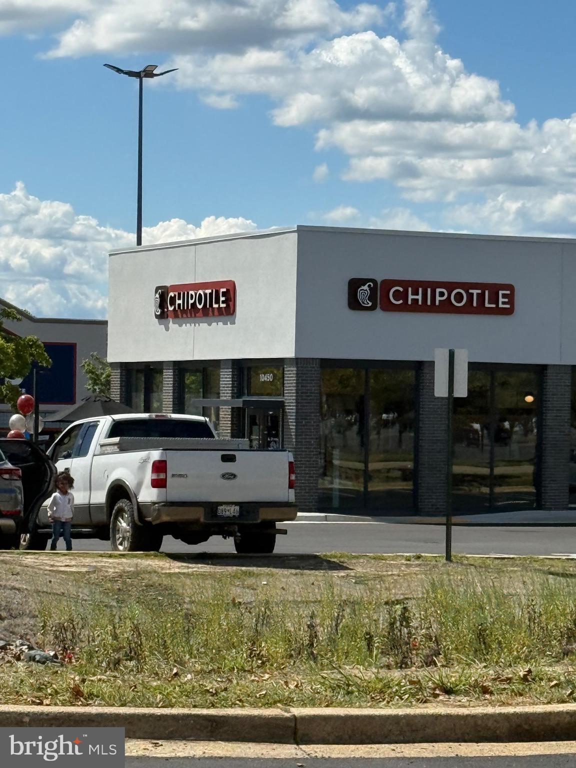 10244 Prince Place, Unit 21T3 Upper Marlboro, MD 20774 - Photo 56 of 64 a view of a car park in front of the house