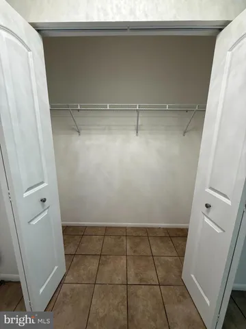 a stove top oven sitting inside of a kitchen