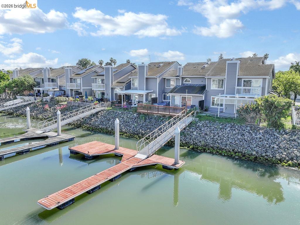 a view of residential houses with outdoor space and swimming pool