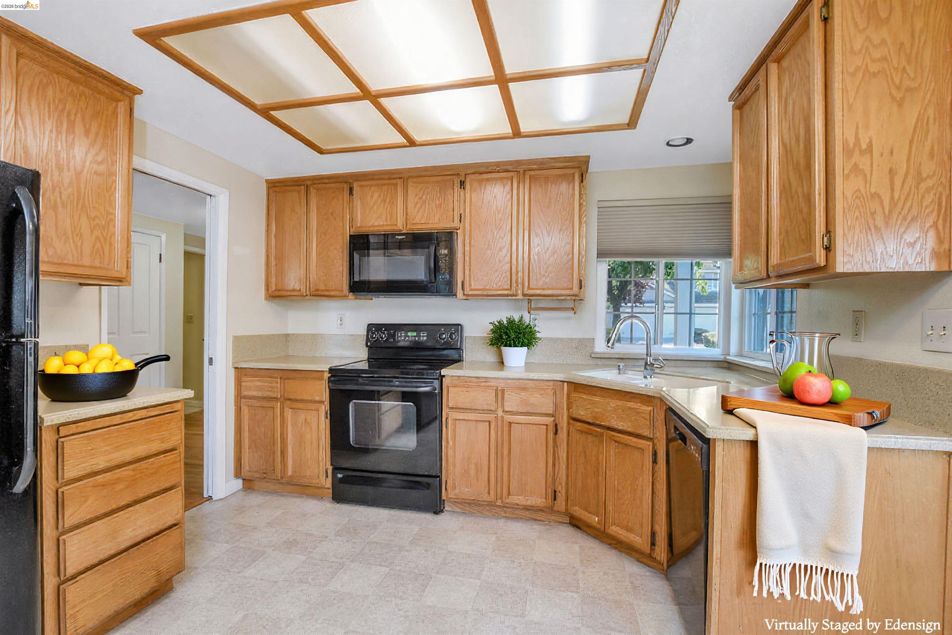 184 Pelican Loop Pittsburg, CA 94565 - Photo 14 of 56 a kitchen with stainless steel appliances granite countertop a sink window and cabinets